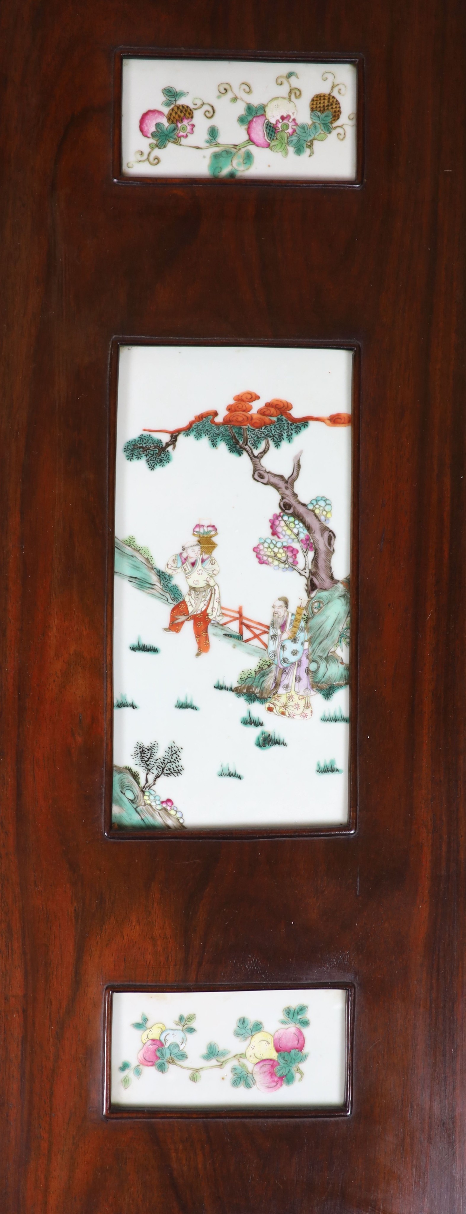 A good Chinese porcelain mounted four fold screen, mid 19th century, the wood possibly zitan, Total size 127cm high x 122cm wide